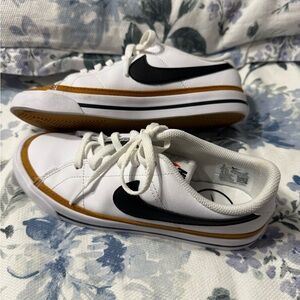 NIKE - Leather White and Black Sneakers with Gold Accents.